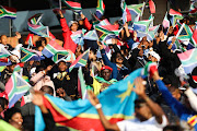 South Africans sing struggle songs as they gather to watch the presidential inauguration on 25 May 2019, at Loftus Stadium in Pretoria. ANC president Cyril Ramaphosa is set to take the oath of office as president of South Africa. 