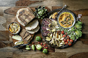 Platter on left: Readymade hummus with smoked paprika and za’atar served with artisan bread. On right: Pumpkin, walnut and sage paté and white asparagus and grilled radicchio salad with vanilla balsamic dressing.