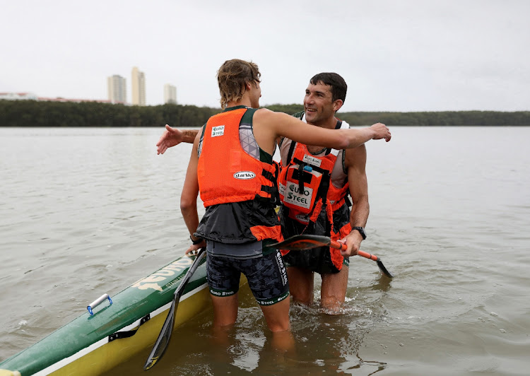 Andy Birkett and Matthew Fenn celebrate after winning the 2024 Dusi Canoe Marathon men's race at the finish at Blue Lagoon in Durban on Saturday. Picture: SANDILE NDLOVU