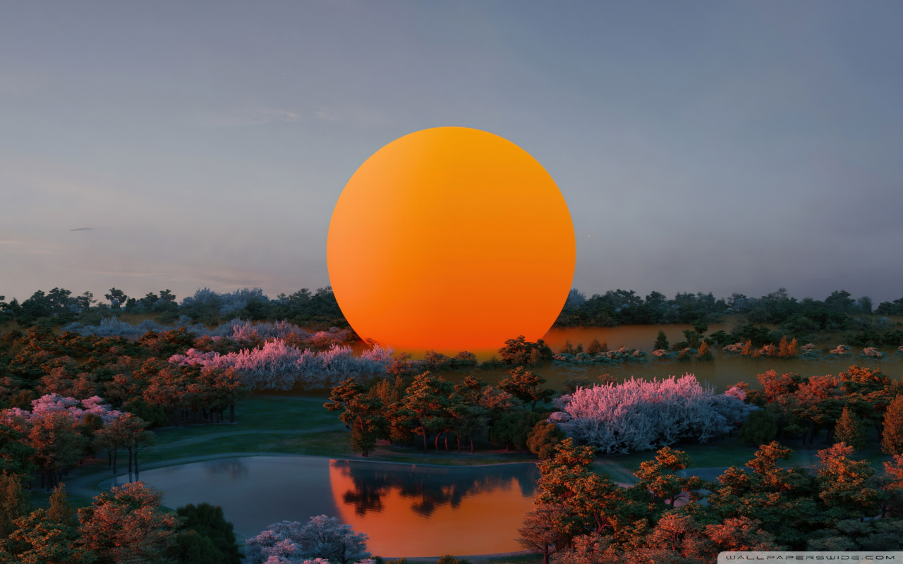 Giant Orange Sun Over Tranquil Lake