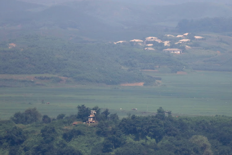 North Korea's propaganda village Kaepoong is seen from the Unification Observation Platform, near the demilitarized zone (DMZ) on July 19, 2023 in Paju, South Korea. A US soldier who had served in South Korea crossed the military demarcation line separating the two Koreas into North Korea without authorization. The man moved into the North during a tour at the Panmunjom Joint Security Area in the Demilitarized Zone.