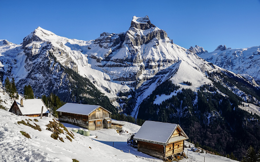 Wooden house in the snowy mountains