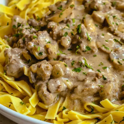 Family-friendly and frugal, this Ground Beef Stroganoff with fresh mushrooms, onions, and garlic in a rich, creamy sour cream sauce is sure to please. Serve it over egg noodles, mashed potatoes, or rice.