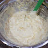 Thumbnail For Two Cans Of Corn, Jiffy, Sour Cream, And Melted Butter Stirred Together In A Bowl.