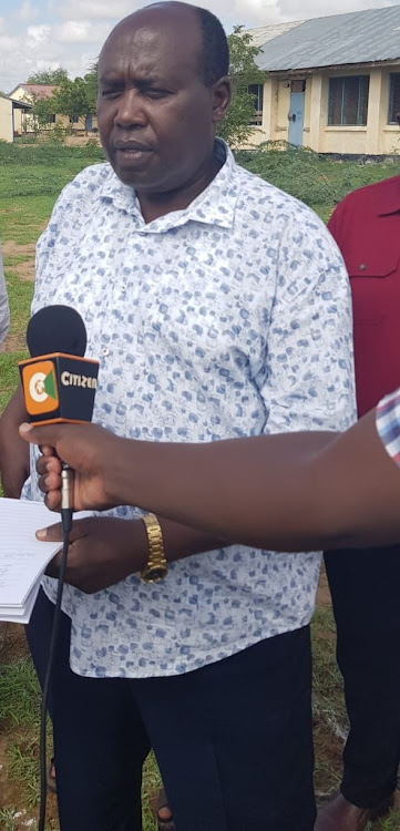 Garissa county commissioner Boaz Cherutich speaking to the press at Garissa high school on Wednesday.