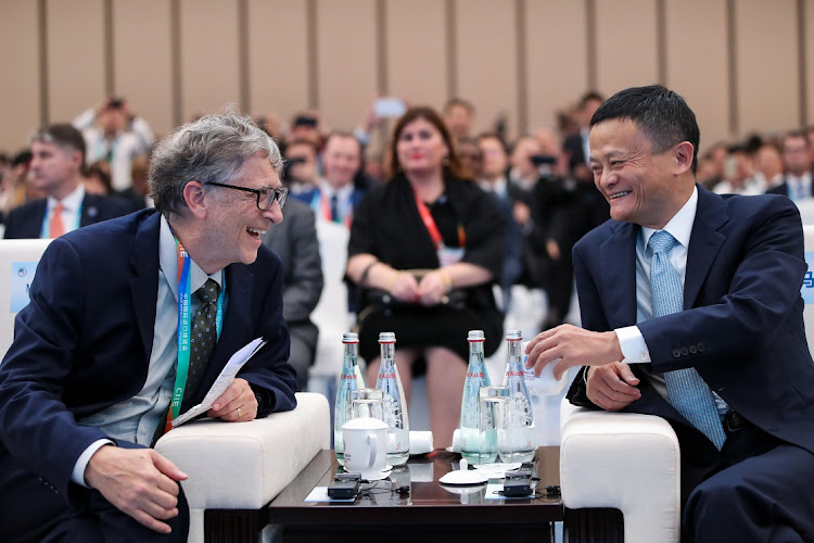 Microsoft founder Bill Gates (L) talks with Alibaba Chairman Jack Ma. Coming from different parts of the world, both have shown tenacity and leadership values to build their empires.