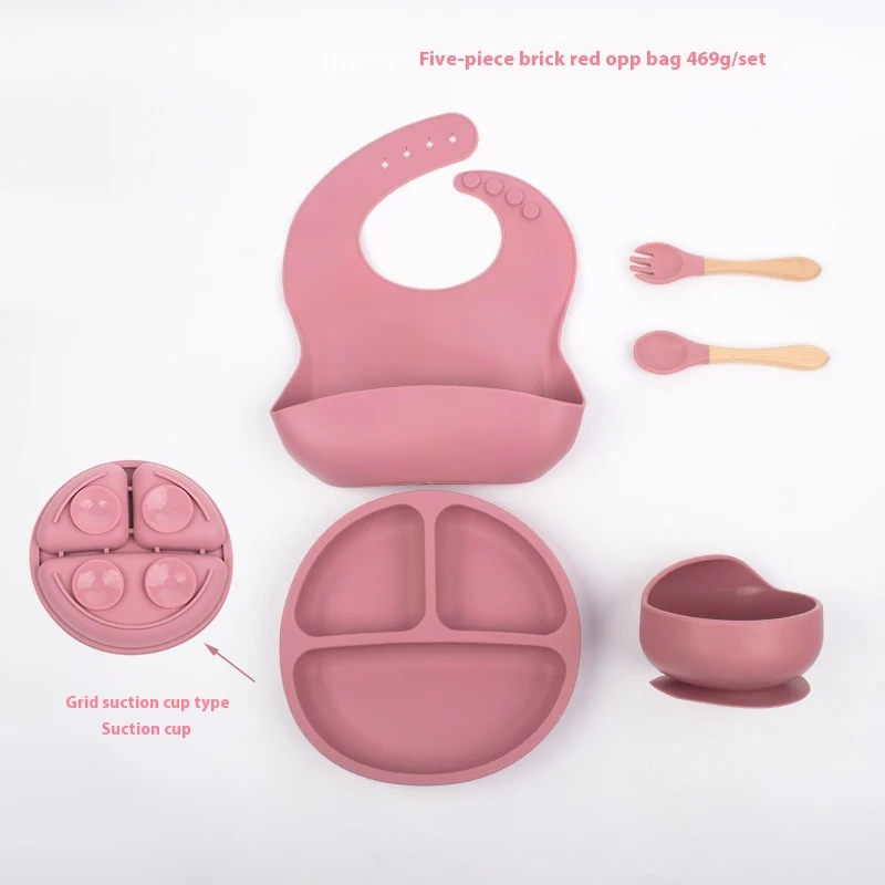 Kinderen's siliconen kom met vakjes, vork, lepel en slab. Ideaal voor de eerste hapjes. Gemakkelijk schoon te maken en veilig voor baby's.