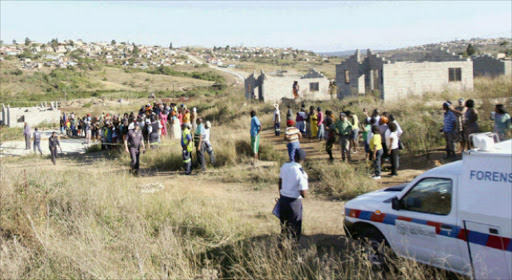 FLASHBACK: The scene where two women's bodies were found among the houses left unfinished in NU6 Mdantsane, which was said to have become a haven for criminals. BCM has now restarted the project. Picture: FILE