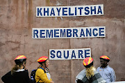 The tourists were visiting a school in Khayelitsha.