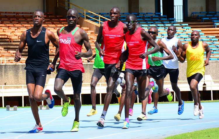 Erick Sang (R) guided by David Korir lead a pack in 1500m race during the trials for Dubai Para Grand prix at Moi,Kasarani.