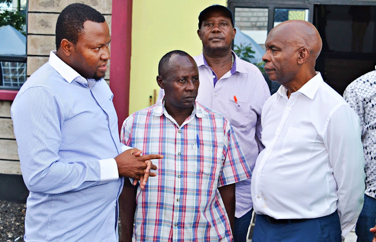 Kitui Assembly speaker Kevin Katisya, the executive director for Centre for Human Rights and Civic Education Peter Mutemi and Prof. Kivutha Kibwana in a discussion during the MCAs training at a Mutomo Hotel on Thursday.