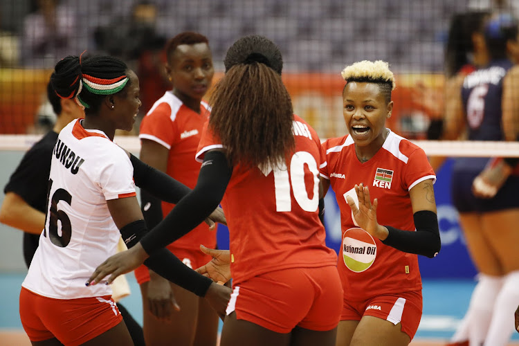 Ntional women's volleyball team players celebrate in a past championship