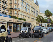 The Renault Twizy is a compact two-seater roaming European city streets.