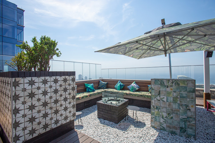 A glass balustrade allows for uninterrupted views of the coastline at Back Yard, a roof top bar in Umhlanga Arch.