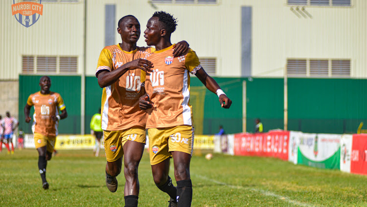 Rightbalc Rowland Makati celebrates with a team mate after scoring his first goal in City Stars colours