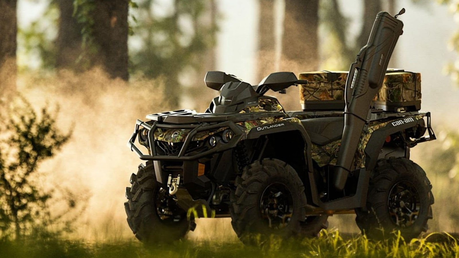 ATV with hunting rifle parked in the woods