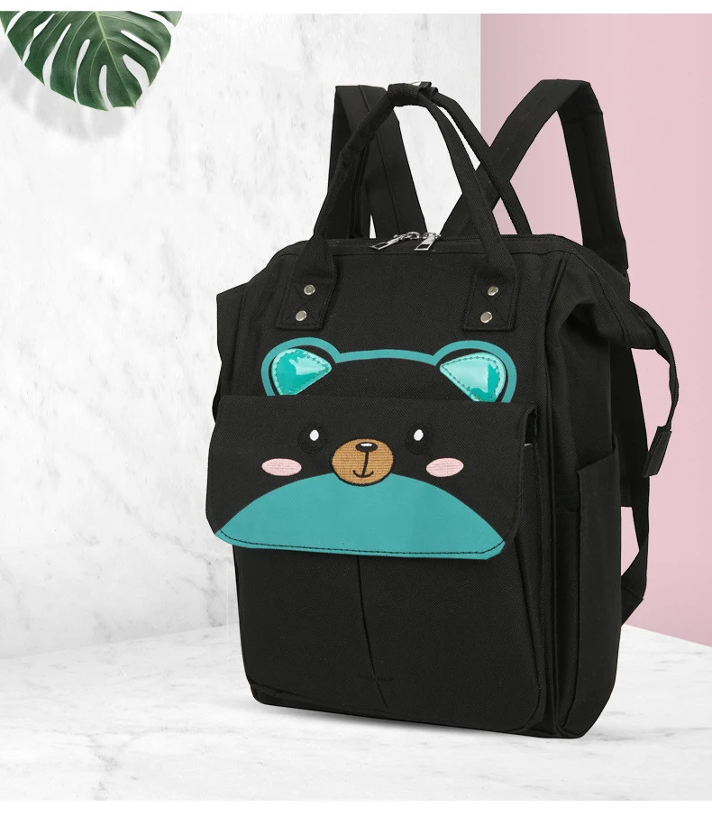 Mochila de pañales multifuncional de gran capacidad con diseño de dibujos animados, ideal para mamás. Amplio espacio y comodidad.