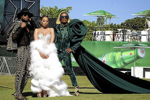 Mohale Motaung and partner Somizi Mhlongo with Khanyi Mbau made heads turn at the Vodacom Durban July 2019, at Greyville Racecourse, yesterday.