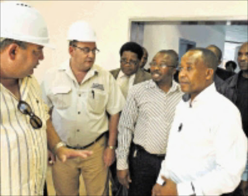 GOOD JOB: MEC Phumulo Masualle, right, with Amangcoya Construction managers Jean Masson and Wayne Skimmer at Holy Cross Hospital. Pic.KAMVA MOKOENA. 07/11/2009. © Unknown.