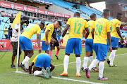 Mamelodi Sundowns striker Peter Shalulile celebrates one of his three goals against Golden Arrows with his teammates. 