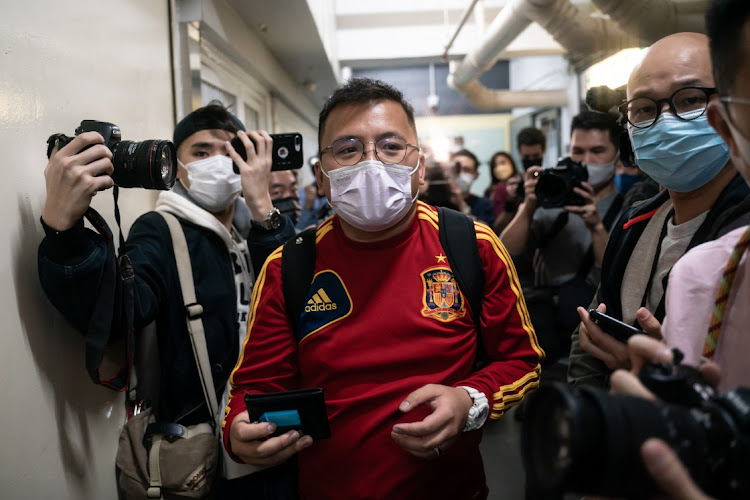 Stand News deputy assignment editor Ronson Chan leaves the Stand News office after police searched the premises of the independent news outlet on December 29 2021 in Hong Kong, China. Picture: GETTY IMAGES/ANTHONY KWAN