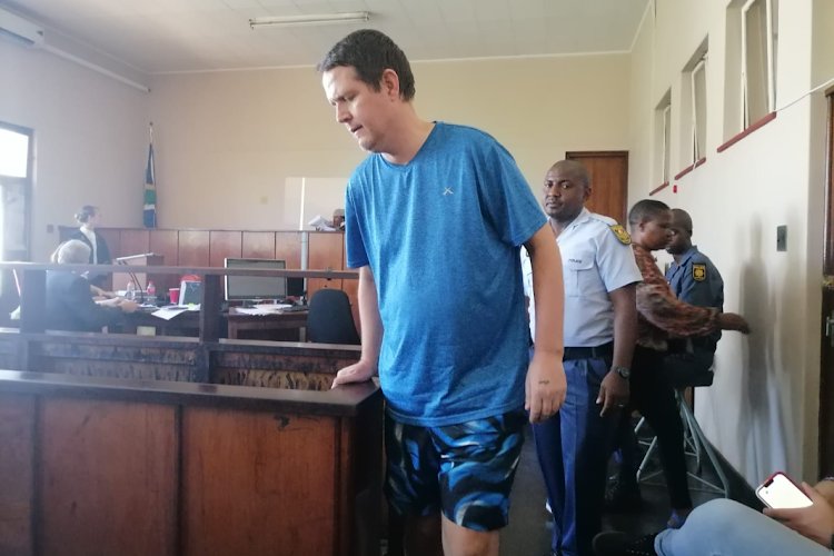 Werner de Jager, husband of slain Amanzimtoti priest Liezel de Jager, heads out of the dock in Amanzimtoti magistrate's court.