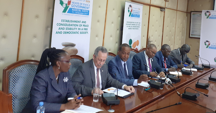 ACP secretary general Patrick I. Gomes, Foreign Affairs PS Macharia Kamau and his Planning counterpart Torome Saitoti and other officials during a press conference at Ministry of Foreign Affairs on November 28, 2019