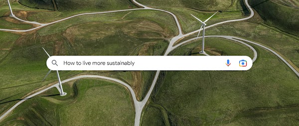 A birds-eye view of a wind farm on top of green, grassy rolling hills with a search bar overlaid.