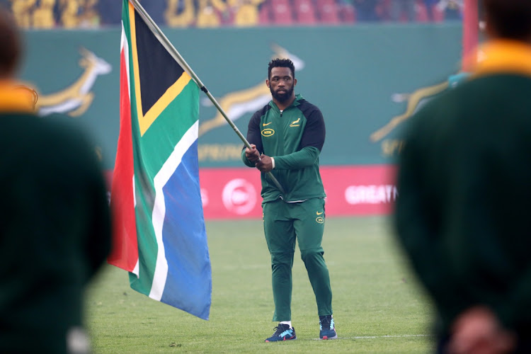 Siya Kolisi holds the SA flag ahead of the Springboks' game against Argentina at Ellis Park last month. Picture: MASI LOSI