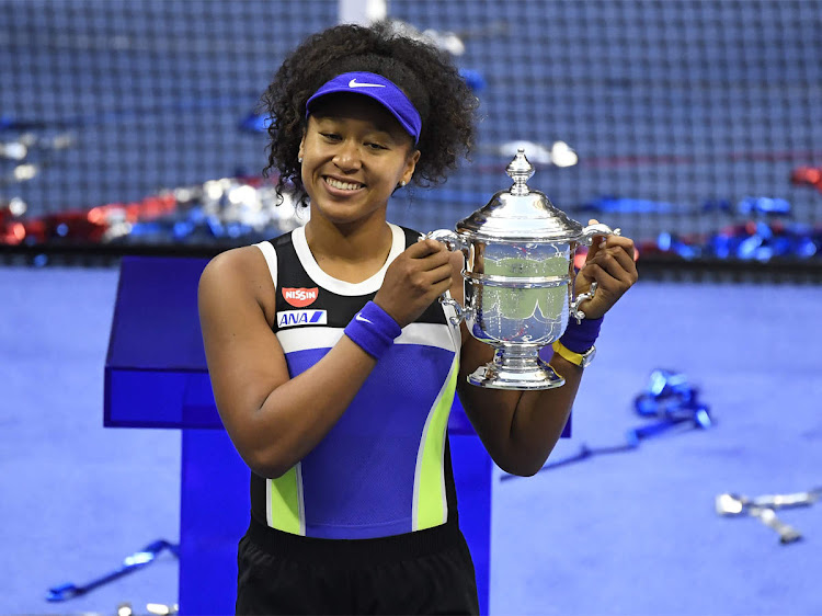 Japan's Naomi Osaka celebrates with the US Open trophy