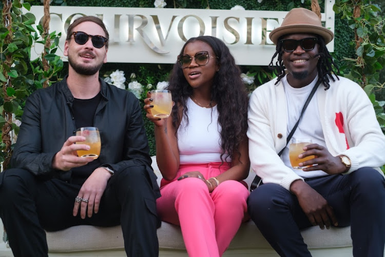 Courvoisier brand ambassadors Tristan du Plessis, Melody Molale and Fhatuwani Mukheli enjoy a cognac cocktail.