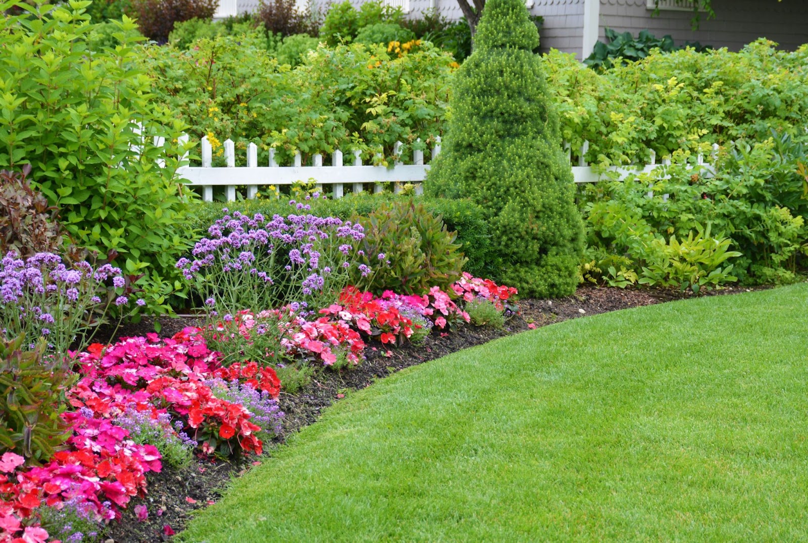 colorful flower beds can improve curb appeal for home buyers 