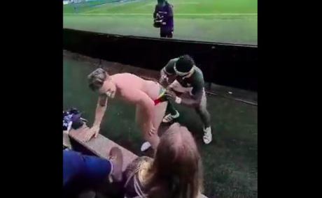 Springbok captain Siya Kolisi puts his autograph on a fan's backside at Murrayfield in Edinburgh.