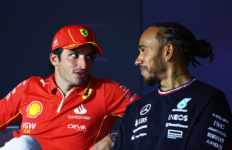 Hamilton (right) will take Sainz’s seat alongside Charles Leclerc at the Italian glamour team next season in a shock move announced earlier this month.