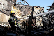 Firefighters douse a fire that broke out at UKZN's Pietermaritzburg campus on Monday night.