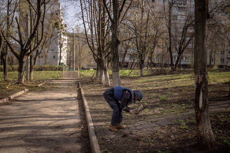 Deminer, Vladyslav Shapoval from the Kharkiv emergency response services unit remove part of a Grad rocket from a park after a recent Russian attack on April 15, 2022 in Kharkiv, Ukraine. After Russian forces retreated from areas around Kyiv, recent reports point to a new offensive as Russian forces have regrouped in the eastern part of the country bringing fears of an escalation of violence.