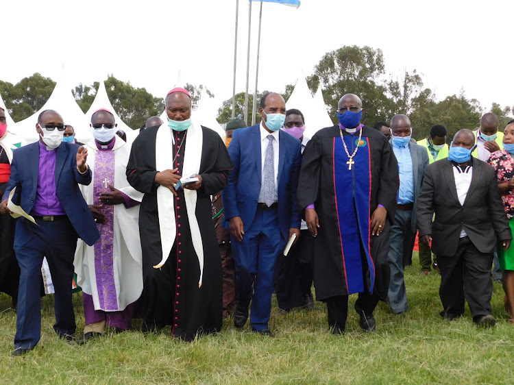 Nyandarua governor Francis Kimemia (centre) with Nyandarua clergy during the dedication the sh500 million road construction equipment at Ol Kalou stadium on Wednesday,May 27,2020