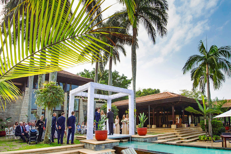 The Palm Court provides a storybook setting for a wedding ceremony.