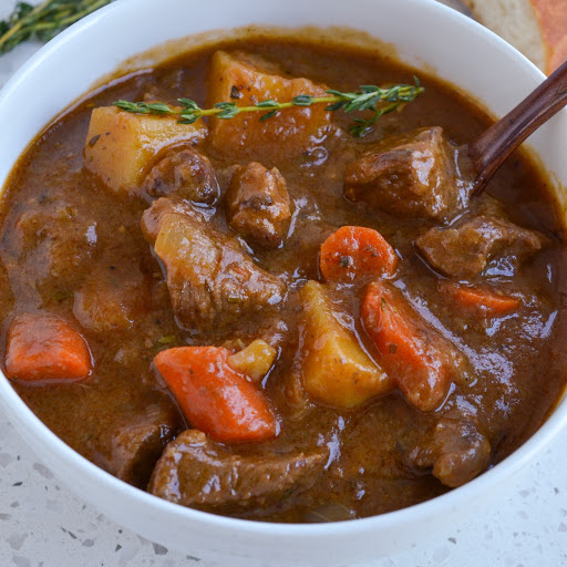 This mouthwatering good Irish Stew is made with tender chuck roast, carrots, onions, and potatoes in a flavorful beef gravy seasoned with rosemary and fresh thyme.