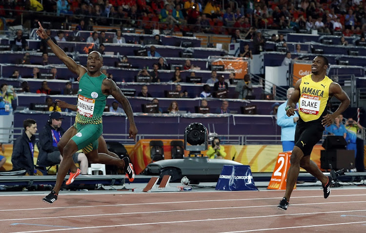 Akani Simbine of South Africa streaks past Yohan Blake of Jamaica to win the Commonwealth Games 100m final at the Carrara Stadium, Gold Coast, Australia. Picture: REUTERS/PAUL CHILDS