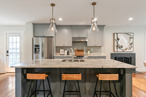 Modern kitchen with island and stools - Buy this luxury property in Tuckahoe, 3 bedrooms