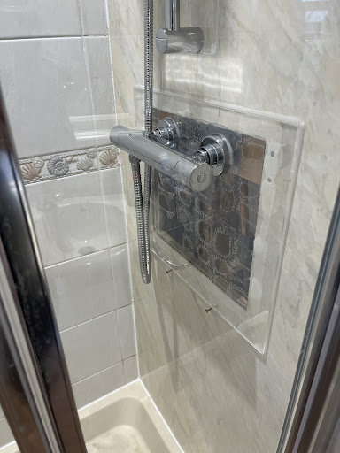 Customer had a leak on an old valve before Christmas requiring large hole to be cut in shower wall board. Bit of a quirky finish. All going in 9months so customer happy. 