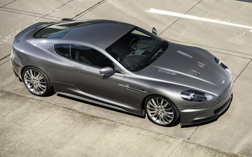 Sleek Silver Sports Car Shines on the Tarmac screenshot 2
