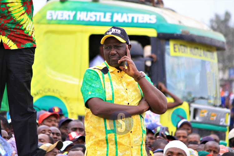 Deputy president William Ruto follows proceedings during campaigns in Nairobi on July 27, 2022.