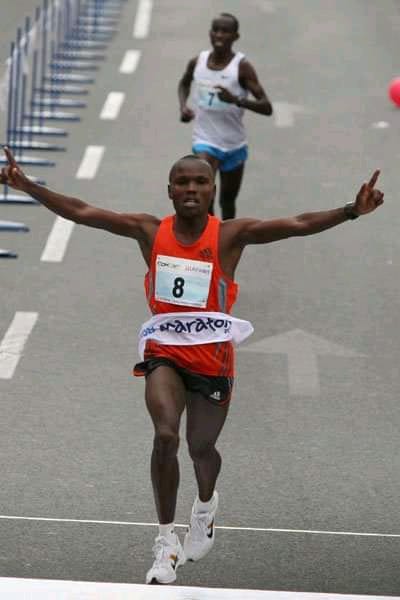 John Katio celebrates in a past race.