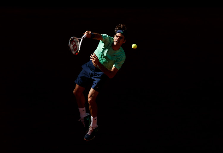 Roger Federer of Switzerland serves at the Madrid Open tennis tournament at the Caja Magica, Spain, May 9 2013. Picture: JASPER JUINEN/GETTY IMAGES