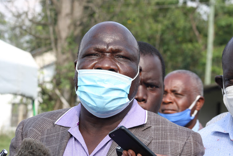 Muhoroni MP Onyango Koyoo and his Tinderet counterpart Julius Melly (partially hidden) during a meeting for sugar sector stakeholders from Kisumu and Nandi counties on September 18, 2020.