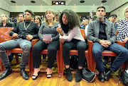 Chester Williams' widow, Maria, flanked by their twins, Matthew and Chloe, and her son, Ryan, at the University of Western Cape memorial service on Wednesday.