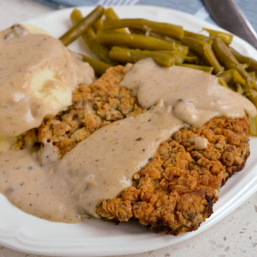 Classic crispy southern chicken fried steak with an easy finger licking good pan gravy made from the drippings.