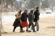 DISAPPOINTED: Mpumelelo Githuka, Nolwazi Githuka, Paul Githuka and Jerry Githuka seen leaving the Orlando magistrates' court yesterday. Pic. Elvis Ntombela. © Sunday World.